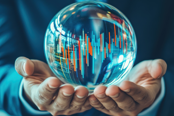 A business professional holds a crystal ball displaying vibrant data graphs, symbolising future predictions and analytics.